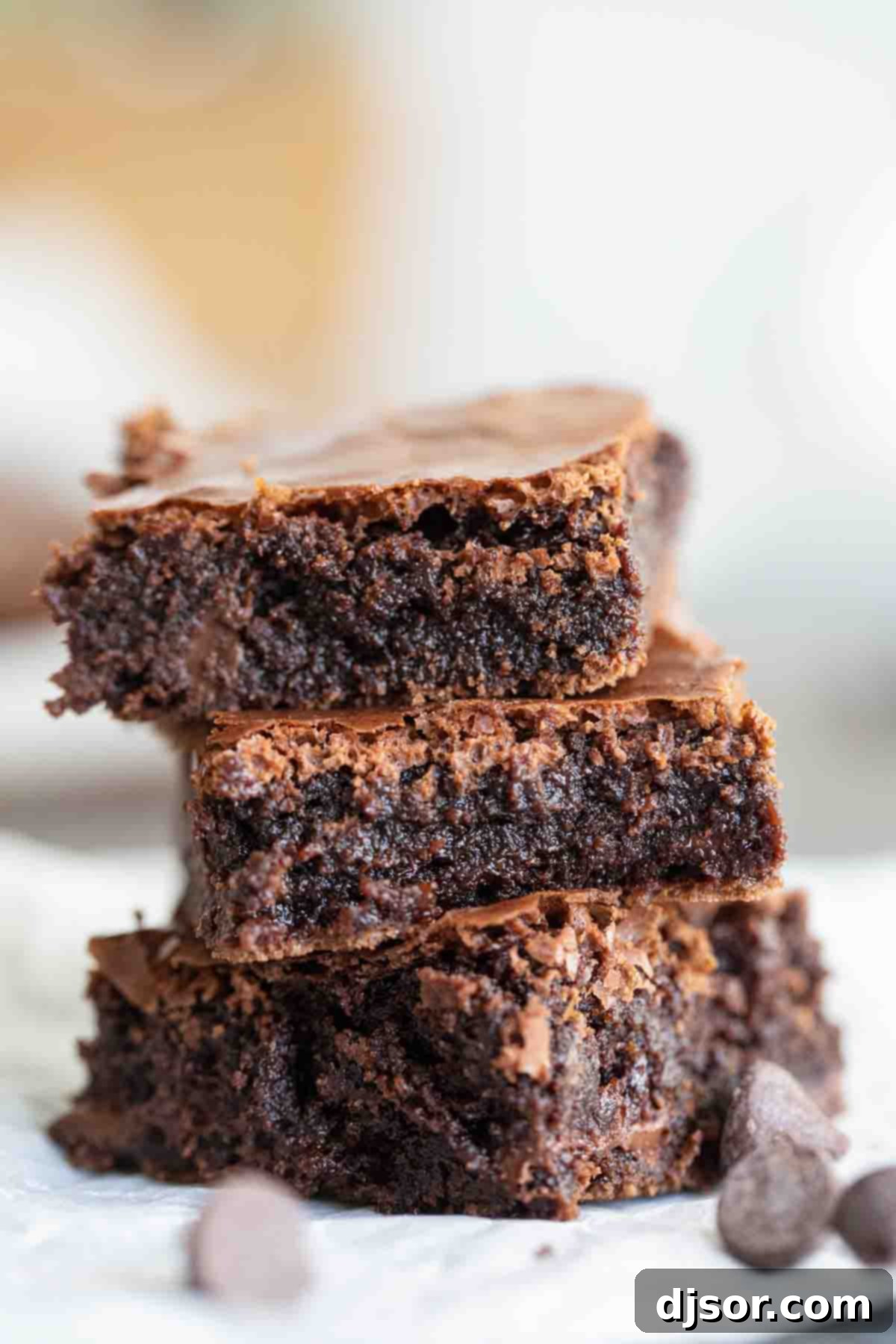 three fudgy brownies stacked