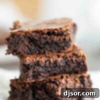three fudgy brownies stacked