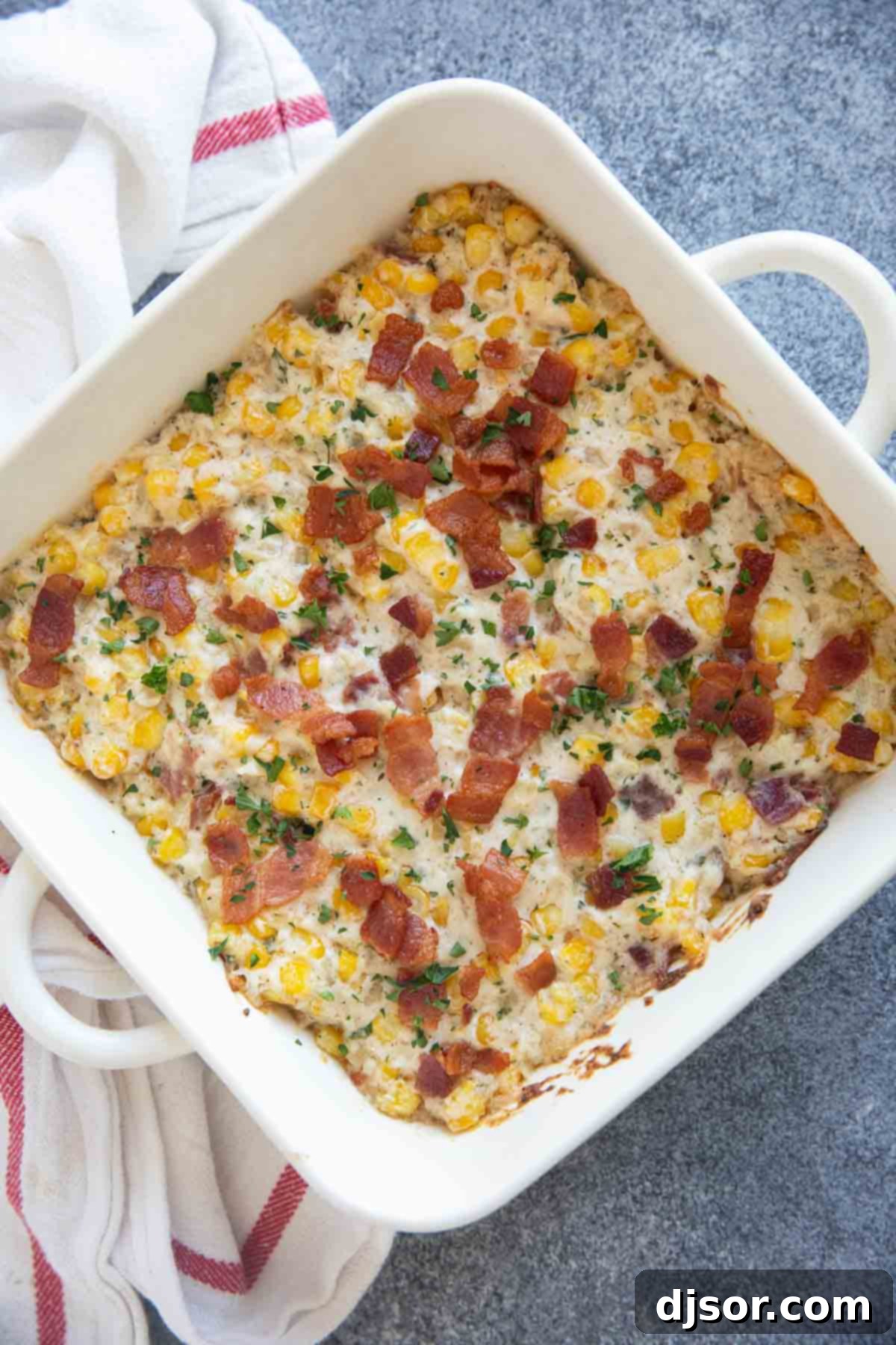 Velvety Corn and Bacon Bliss 7 A square casserole dish filled to the brim with hot and bubbly Creamy Corn and Bacon, freshly out of the oven.