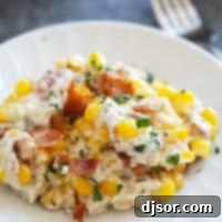 Velvety Corn and Bacon Bliss 9 Plate with creamy corn and bacon, topped with extra bacon.