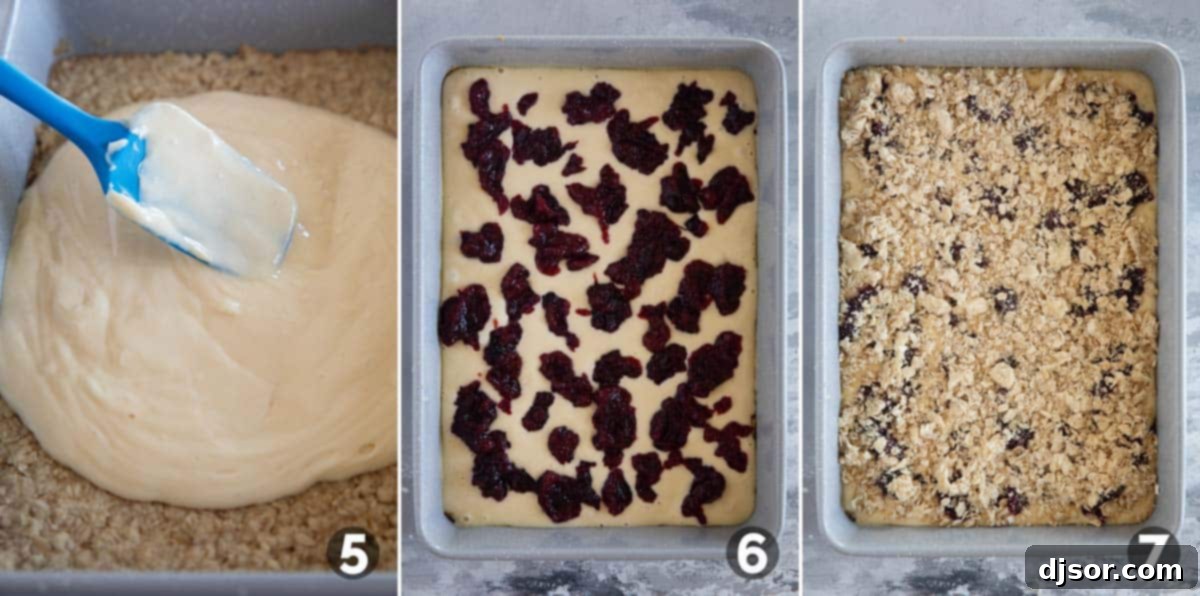 Assembling Cranberry Cheesecake Bars by adding cheesecake layer, cranberry layer, and crumb topping.
