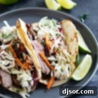 Siam Street Tacos 9 Thai Tacos with cilantro lime slaw and fresh lime slices.