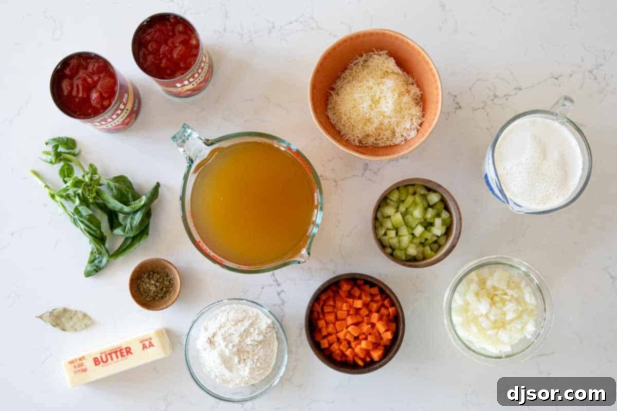 An easy slow cooker soup recipe, this Tomato Basil Soup is full of tomato flavor, is super creamy, and is easily a family favorite! Ingredients laid out for making creamy slow cooker tomato basil soup.