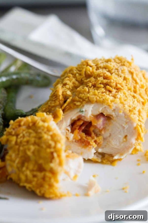 Close up of Cheddar and Bacon Stuffed Chicken with crispy coating
