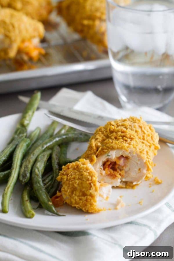 Cheddar and Bacon Stuffed Chicken on a dinner plate