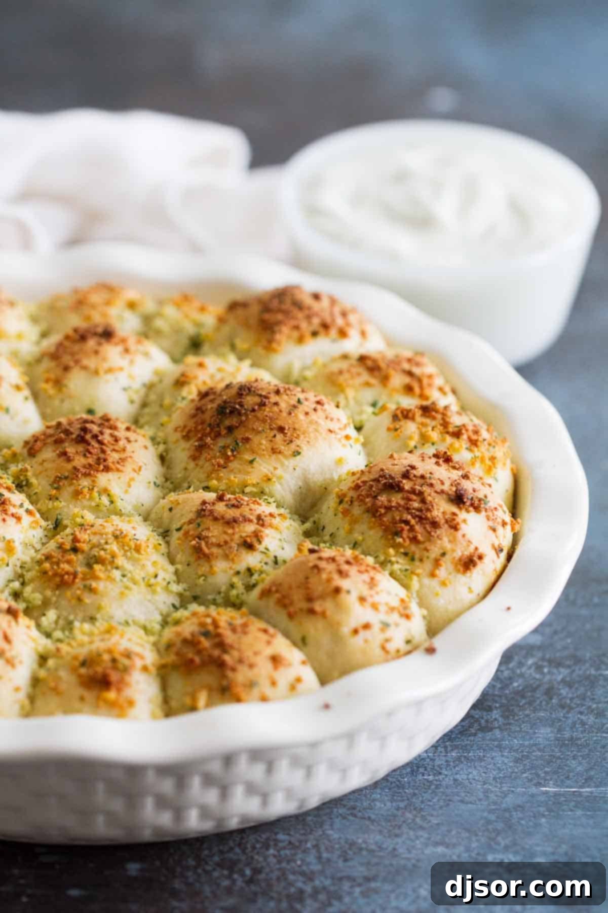 Golden brown Stuffed Pizza Rolls arranged neatly in a round baking dish, ready to be served.