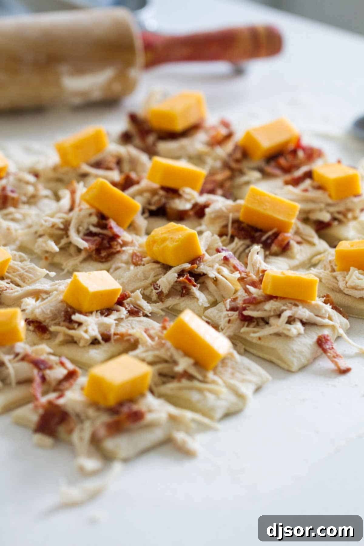 A close-up shot of the chicken, bacon, and cheese filling, ready to be wrapped in pizza dough.