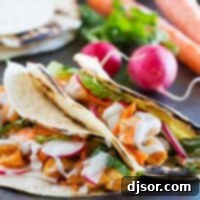 Buffalo Chicken Tacos made with buffalo chicken, lettuce, radishes, and blue cheese sauce.
