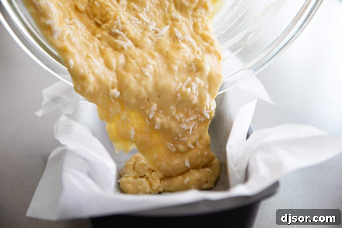 Tropical Coconut Loaf 3 Pouring Coconut Bread Batter into Loaf Pan