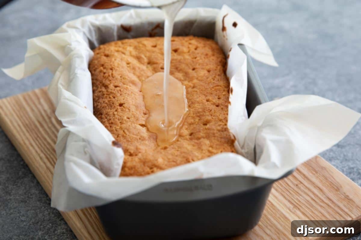 Tropical Coconut Loaf 4 Pouring Coconut Syrup on Quick Bread