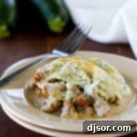 Zucchini Sausage Casserole served on a plate with a fork.
