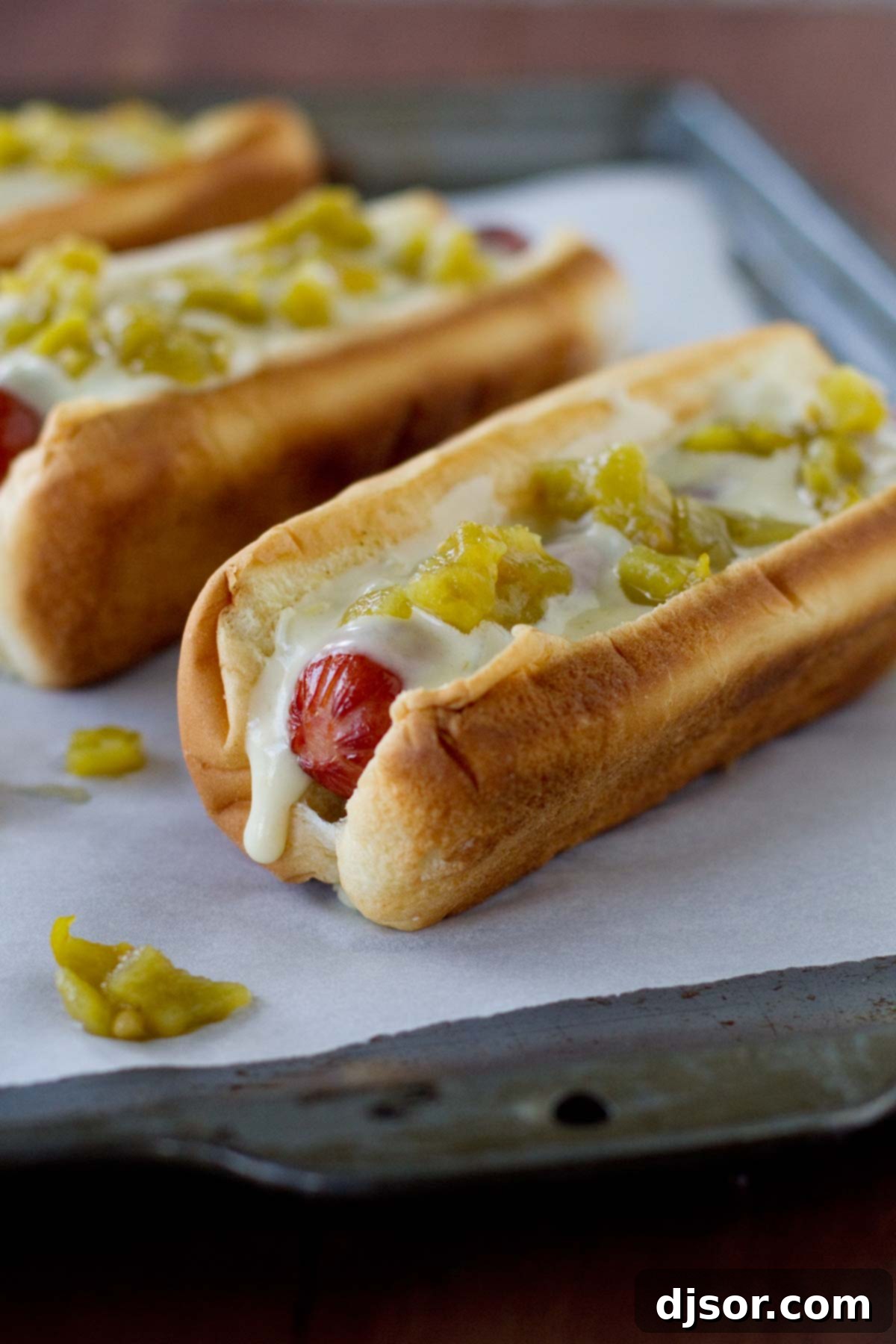 Green Chile Hot Dogs with a green chile sauce and diced green chiles.