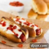 Pizzadogs 2 Two pizza dogs topped with cheese and pepperoni.
