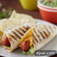 The MexiDog 2 Two Taco Dogs on a plate - hot dogs wrapped in a tortilla and grilled