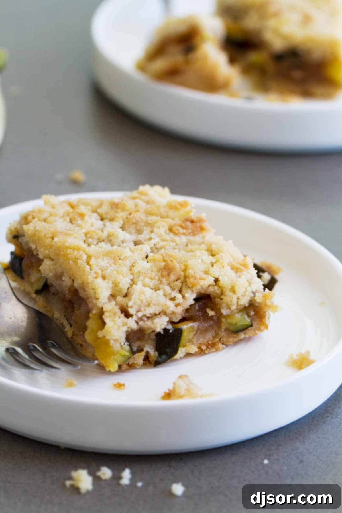 Zucchini Cobbler Bar on a plate with a fork