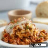 Easy Lasagna Pinwheels 12 Single Lasagna Roll Up on a plate with parsley sprinkled on top.