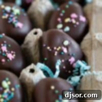 Fluffy Easter Marshmallow Truffles 2 An open egg carton filled with perfectly crafted, chocolate-covered Easter Egg Marshmallow Creme Truffles, ready for enjoyment.