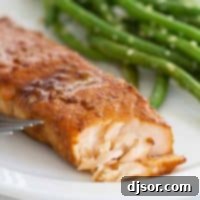 Ginger Soy Glazed Salmon 5 flaked Soy Ginger Salmon dinner with green beans on the plate.