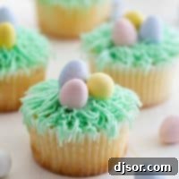 Easter Cupcakes Recipe topped with candy eggs.