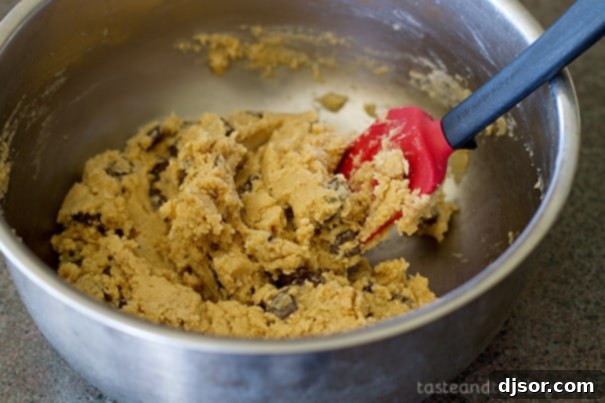 Cookie crust dough being mixed for Caramel Cookie Cheesecake Bars.
