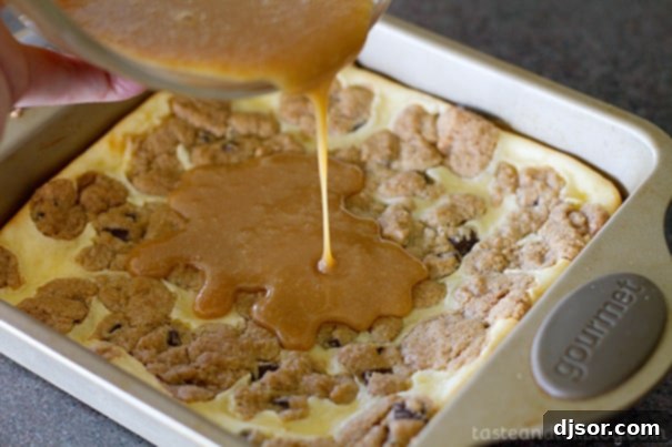 Adding rich caramel sauce on top of cooled Caramel Cookie Cheesecake Bars.