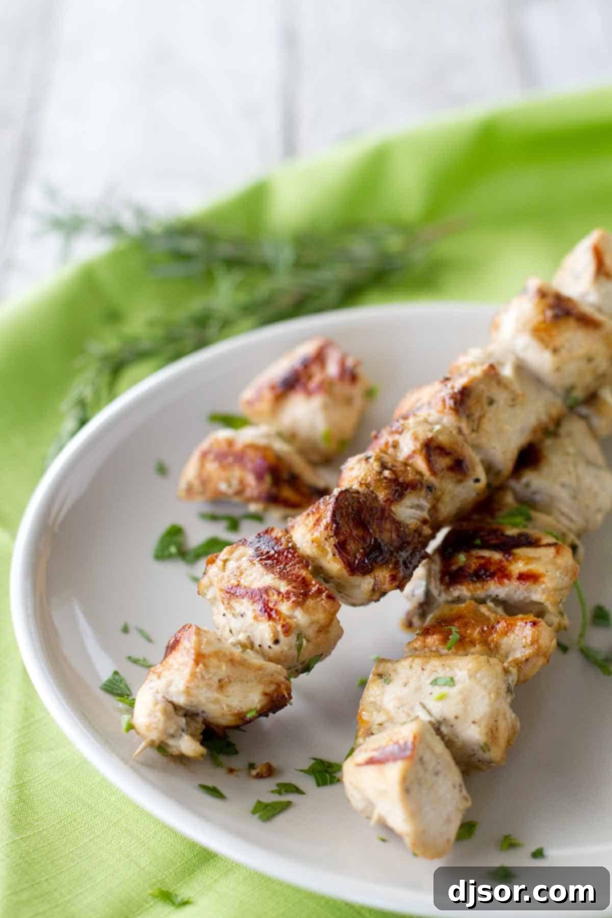 Grilled chicken marinated with rosemary and ranch, skewered and ready to serve
