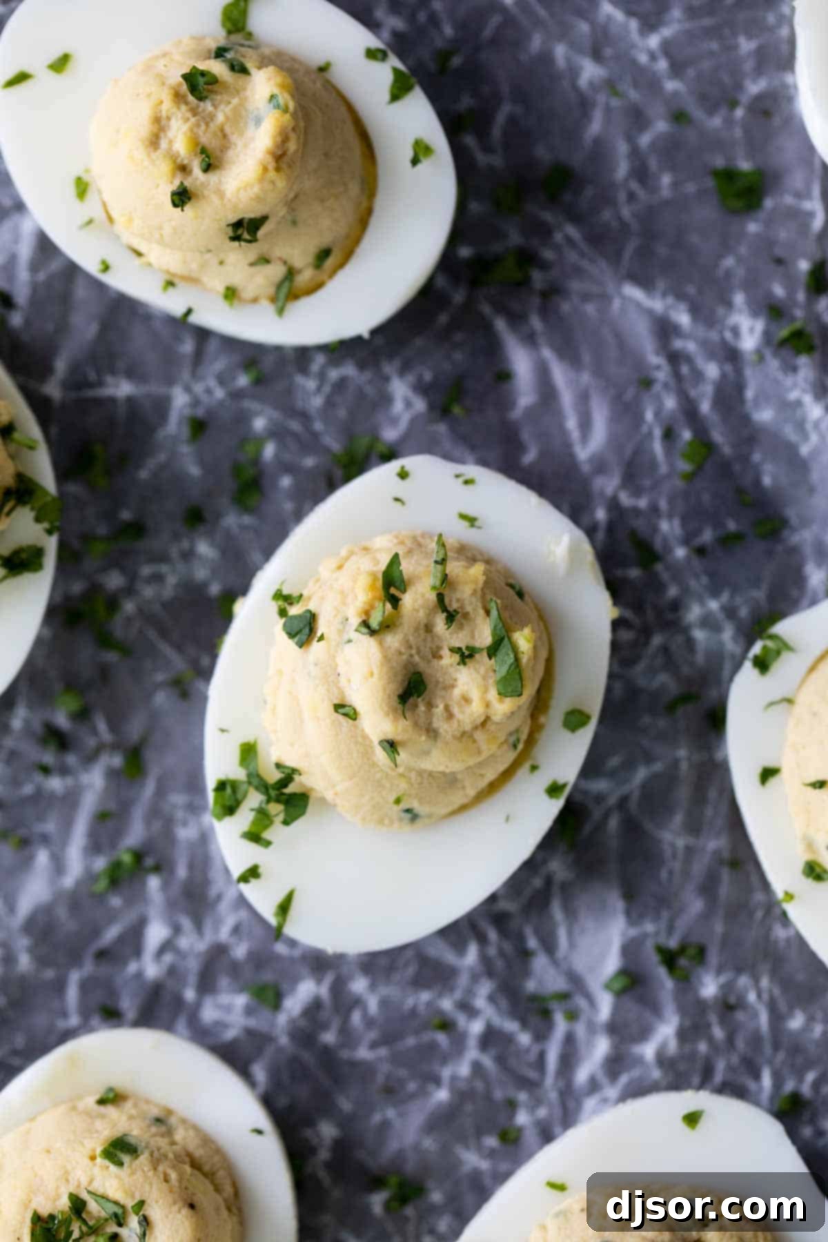 Savor the fusion: Deviled Eggs infused with authentic Asian Flavors. Deviled Eggs with a delightful blend of Asian Flavors, perfectly plated for an appetizer.