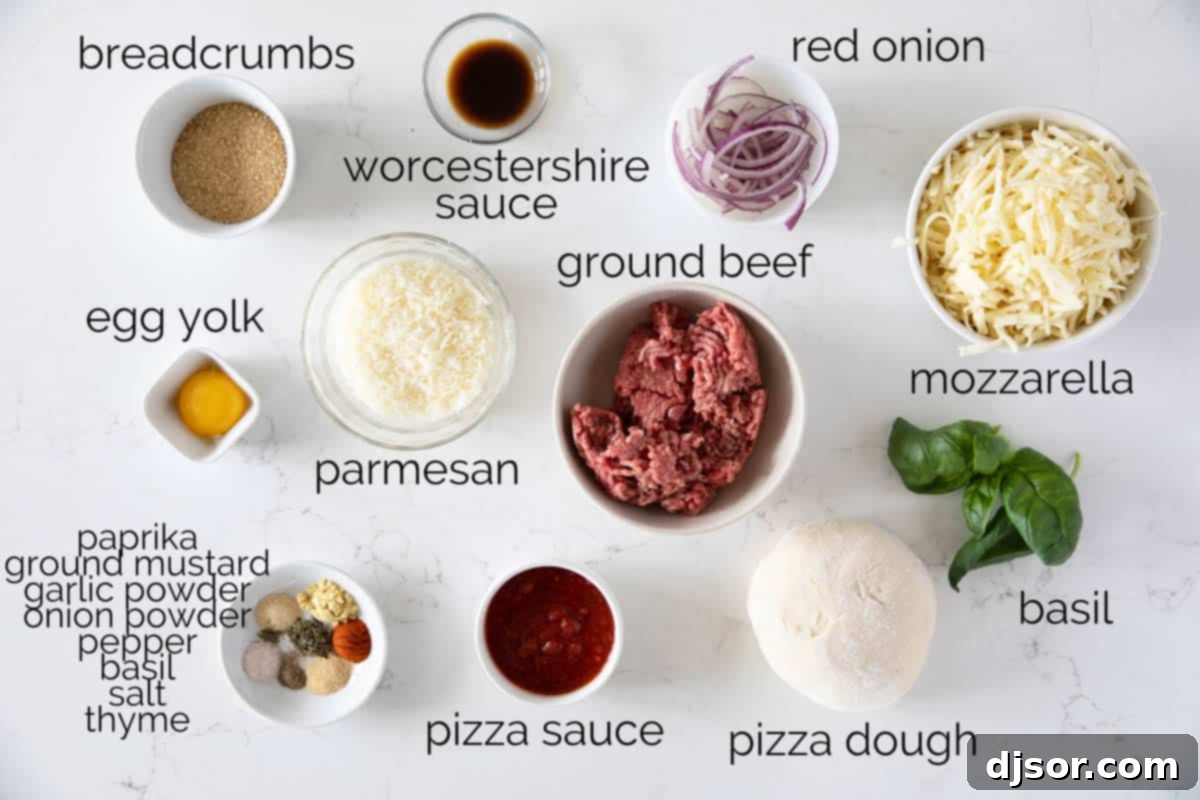 Comfort food at its finest – this Meatball Pizza is topped with homemade meatballs, onions and lots of cheese. Elevate your pizza night with this delicious recipe that will have everyone asking for seconds. A collection of fresh ingredients laid out on a countertop, including ground beef, breadcrumbs, Parmesan cheese, various spices, a red onion, and fresh basil, ready to be transformed into a delicious Meatball Pizza.