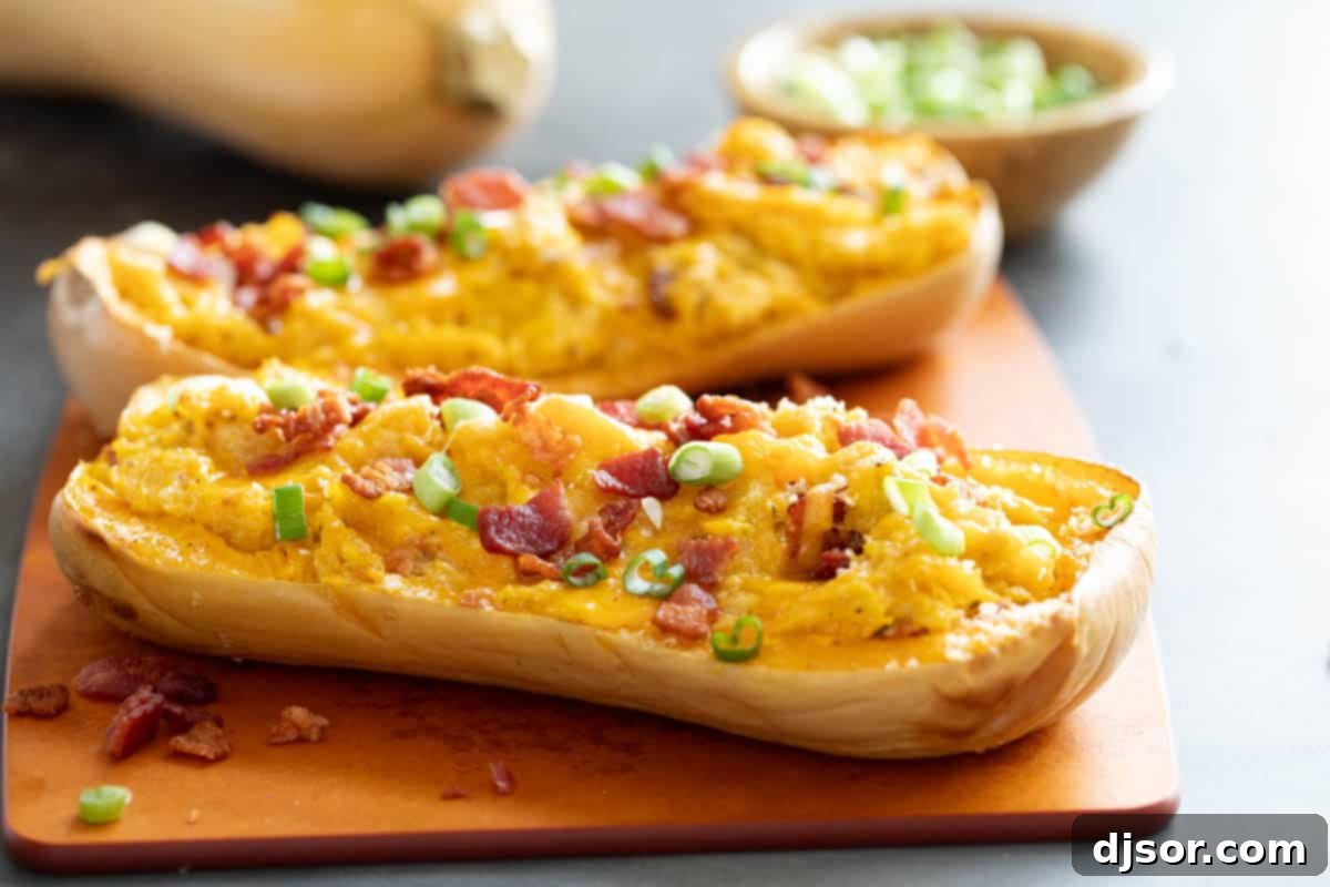 Savory Stuffed Butternut Squash Delight 2 Stuffed Butternut Squash halves on a cutting board.