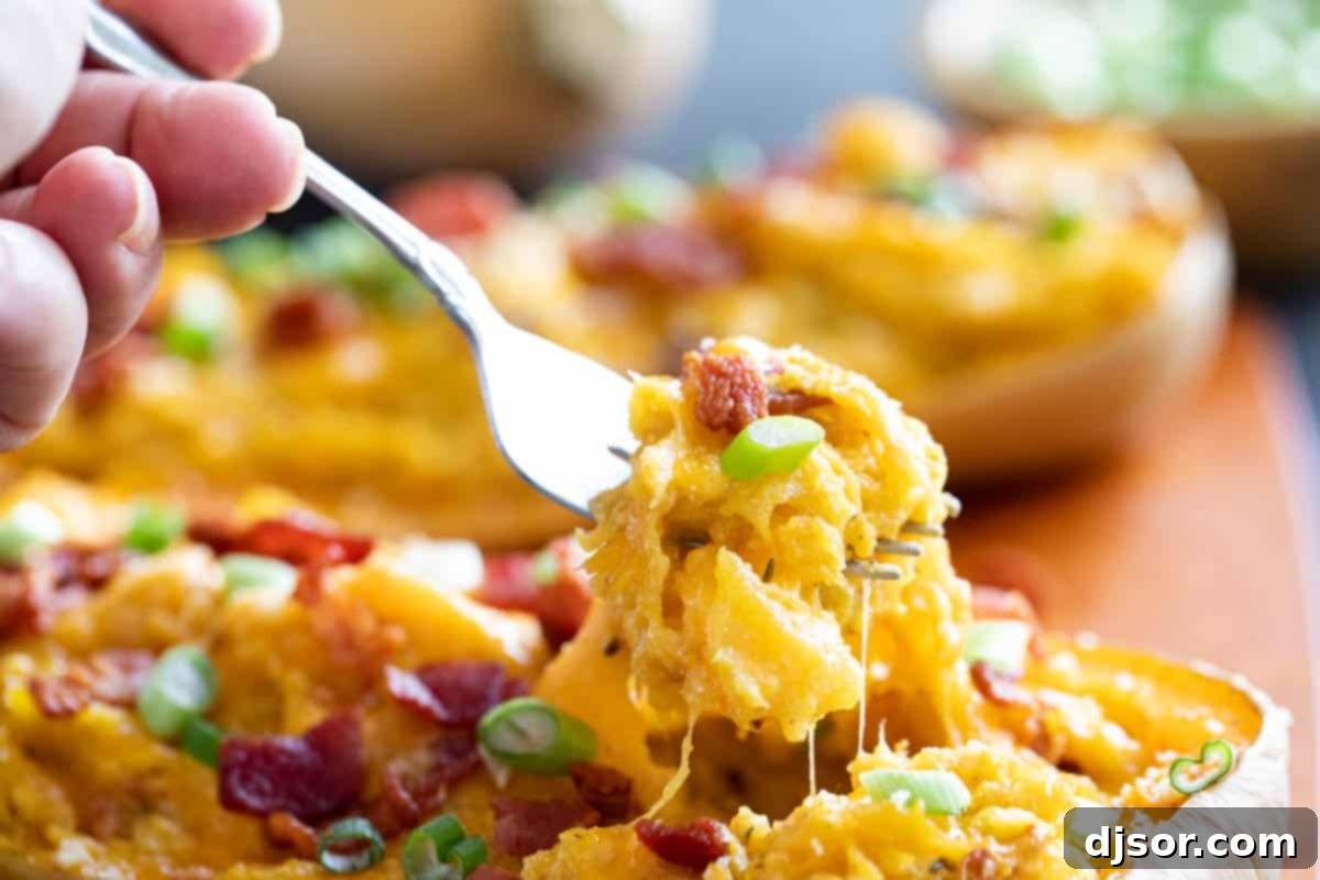 Savory Stuffed Butternut Squash Delight 6 Fork full of stuffed butternut squash with bacon.