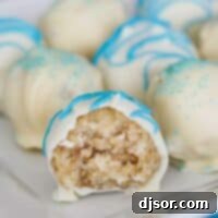 Coconut Cake Truffle with a bite taken from it.