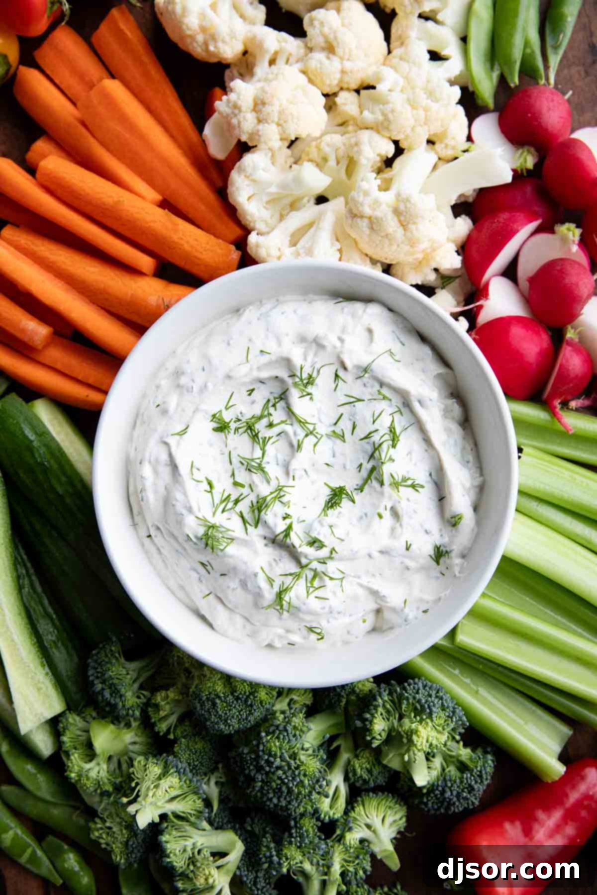 Creamy Dill Delight 5 Bowl filled with dill dip, surrounded by assorted vegetables.