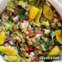 The Ultimate Italian Chopped Salad 2 Italian Chopped Salad with pasta, meat, and cheese.