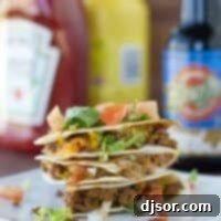 Bacon Cheeseburger Quesadillas stacked on a plate