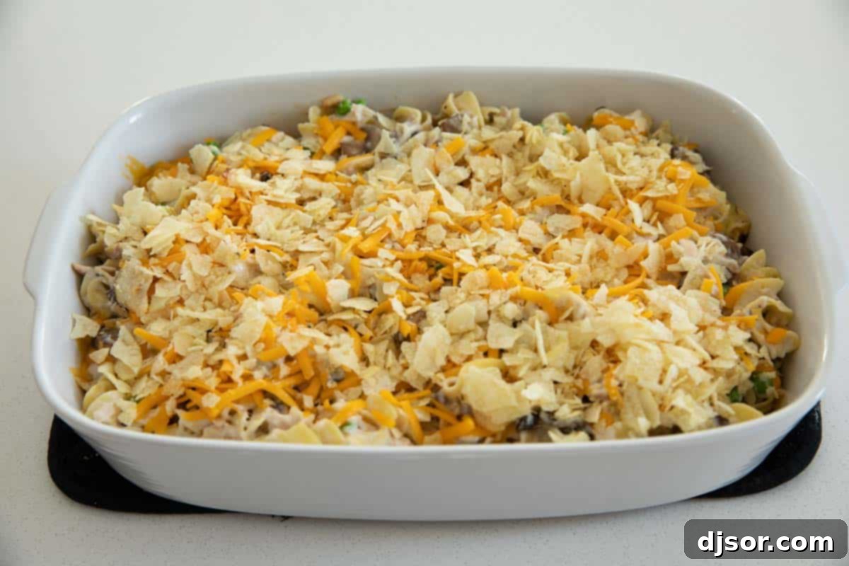 Topping a Tuna Casserole with Cheese and Potato Chips
