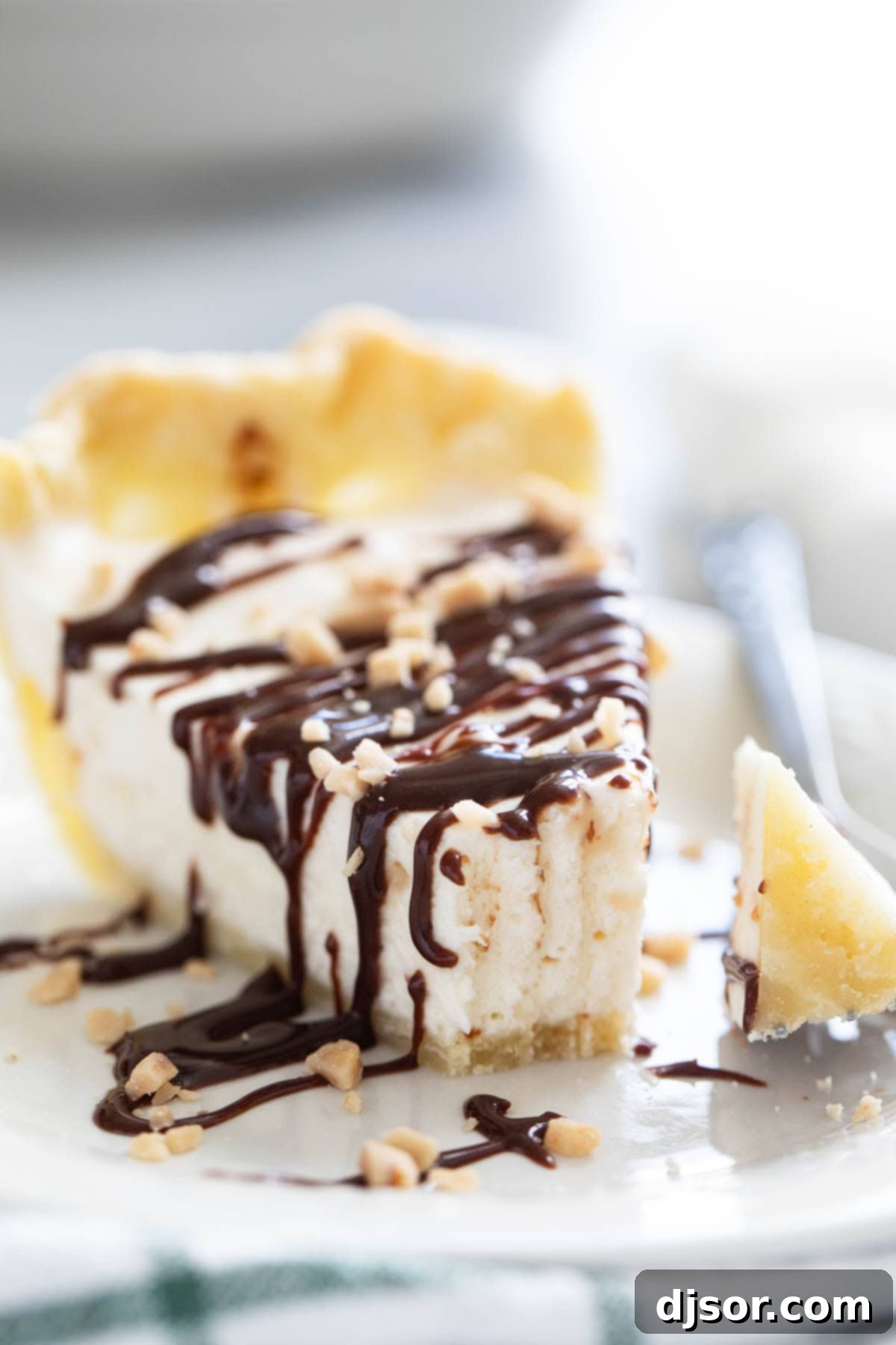 Slice of Toffee Marshmallow Pie with a bite taken from it.