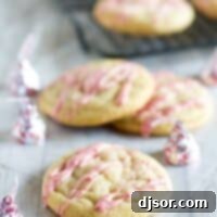 Candy Cane Kiss Stuffed Pudding Cookies with icing made from peppermint kisses.