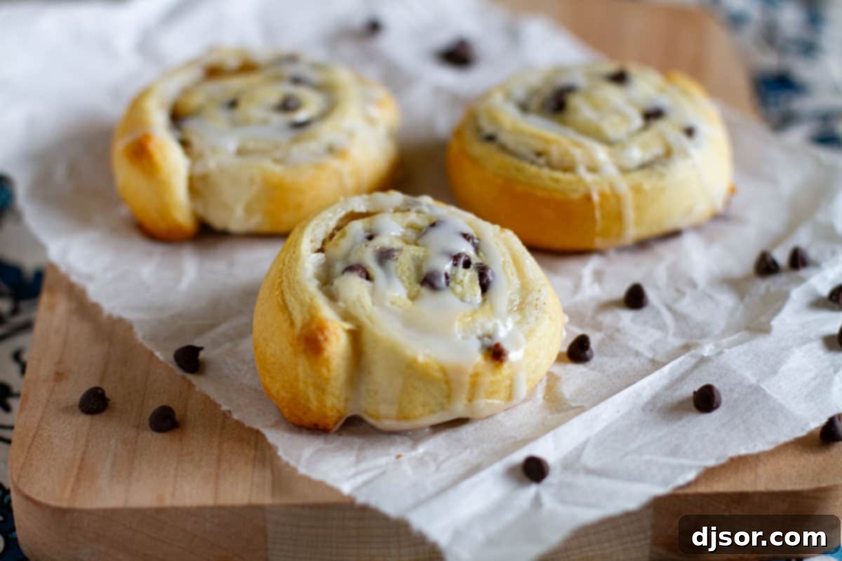 Flaky Chocolate Chip Crescent Cookies 2 Chocolate Chip Crescent Roll Cookies filled with cream cheese and chocolate chips and topped with a simple glaze.