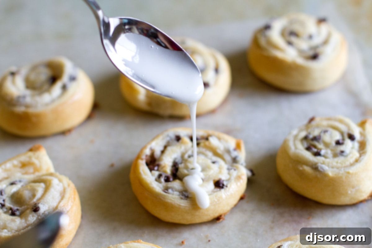 Flaky Chocolate Chip Crescent Cookies 5 Adding glaze to chocolate chip crescent roll cookies.