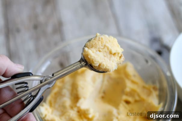 Ultimate Loaded Potato Poppers 4 Rolling mashed potato into 1-inch balls