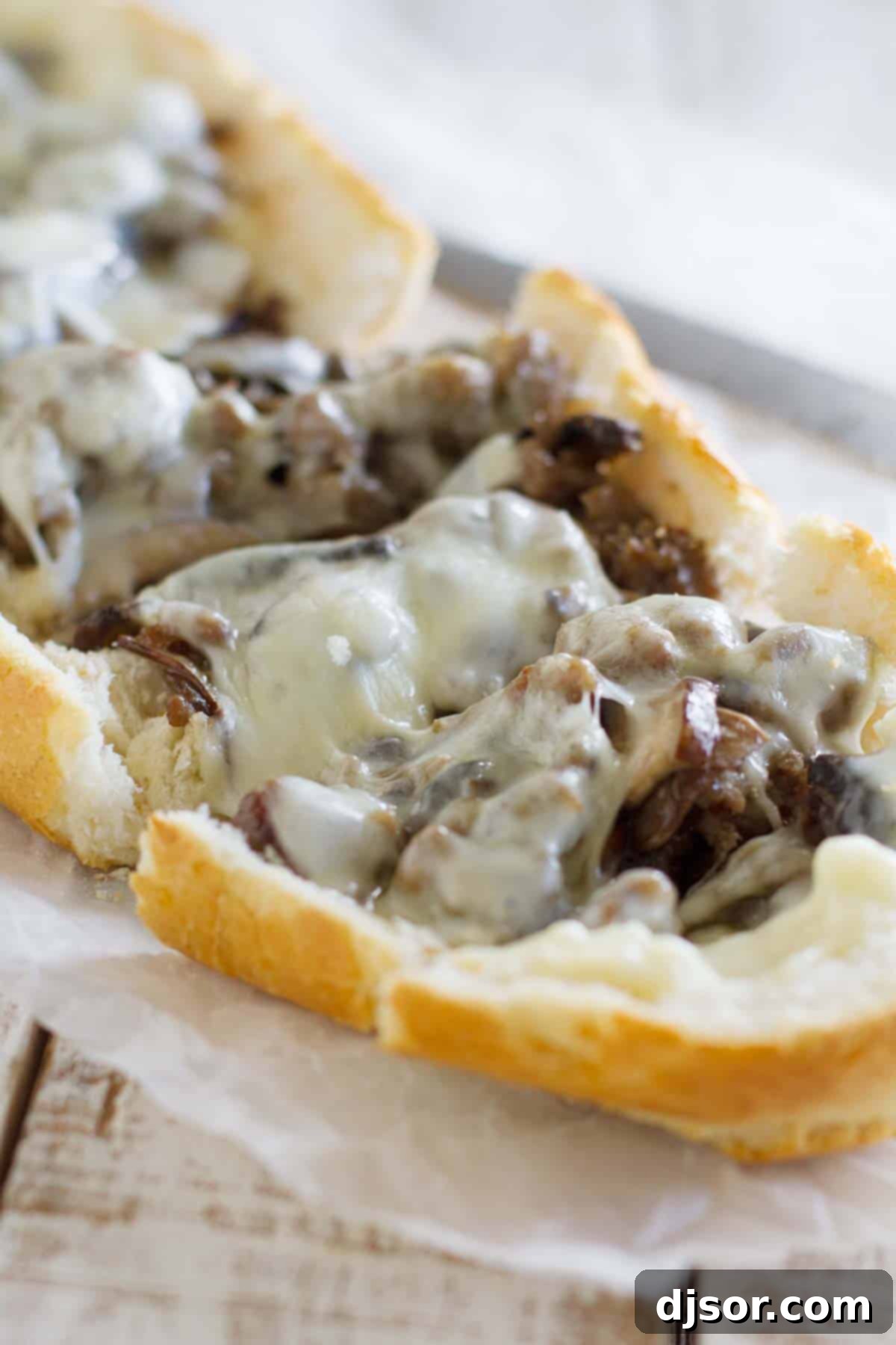 Gourmet Sausage and Portobello French Bread Pizza 2 Crispy French bread pizza loaded with savory Italian sausage, earthy portobello mushrooms, and melted provolone cheese.
