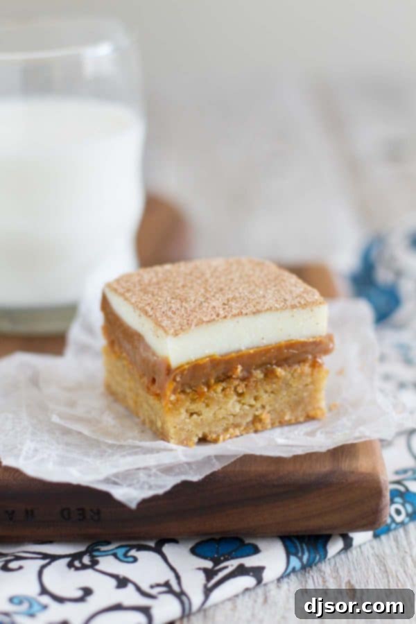 A soft, brown sugar blondie is topped with lots of dulce de leche, white chocolate, and of course, plenty of cinnamon-sugar in these Caramel Snickerdoodle Bars! Decadent Caramel Snickerdoodle Bars with layers of blondie, dulce de leche, and white chocolate