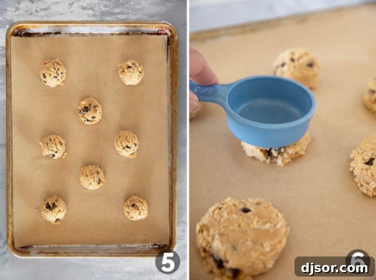 Ultimate Peanut Butter Oatmeal Chocolate Chip Cookies 6 Peanut Butter Oatmeal Cookie dough on a baking sheet, and flattening cookies with a measuring cup before baking.