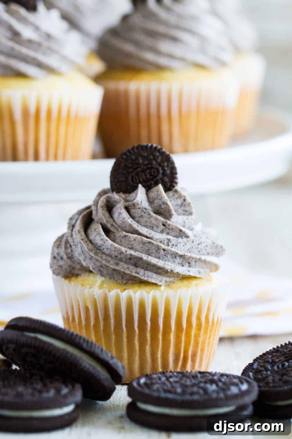 Decadent Oreo Cupcakes with a creamy marshmallow filling and rich Oreo buttercream frosting.