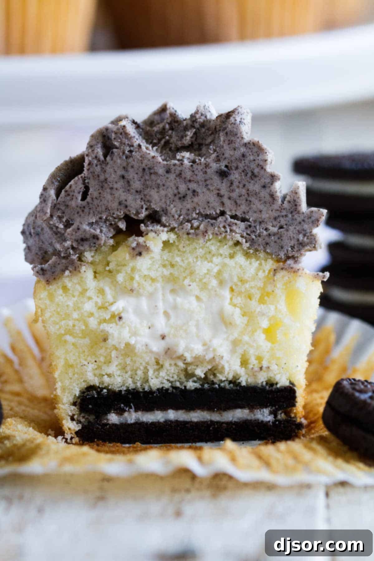 Close-up of an Oreo Cupcake showing the marshmallow filling and the Oreo cookie at the base.