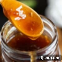 Whip Up Your Own Teriyaki Sauce 2 wooden spoon with spoonful of homemade teriyaki sauce