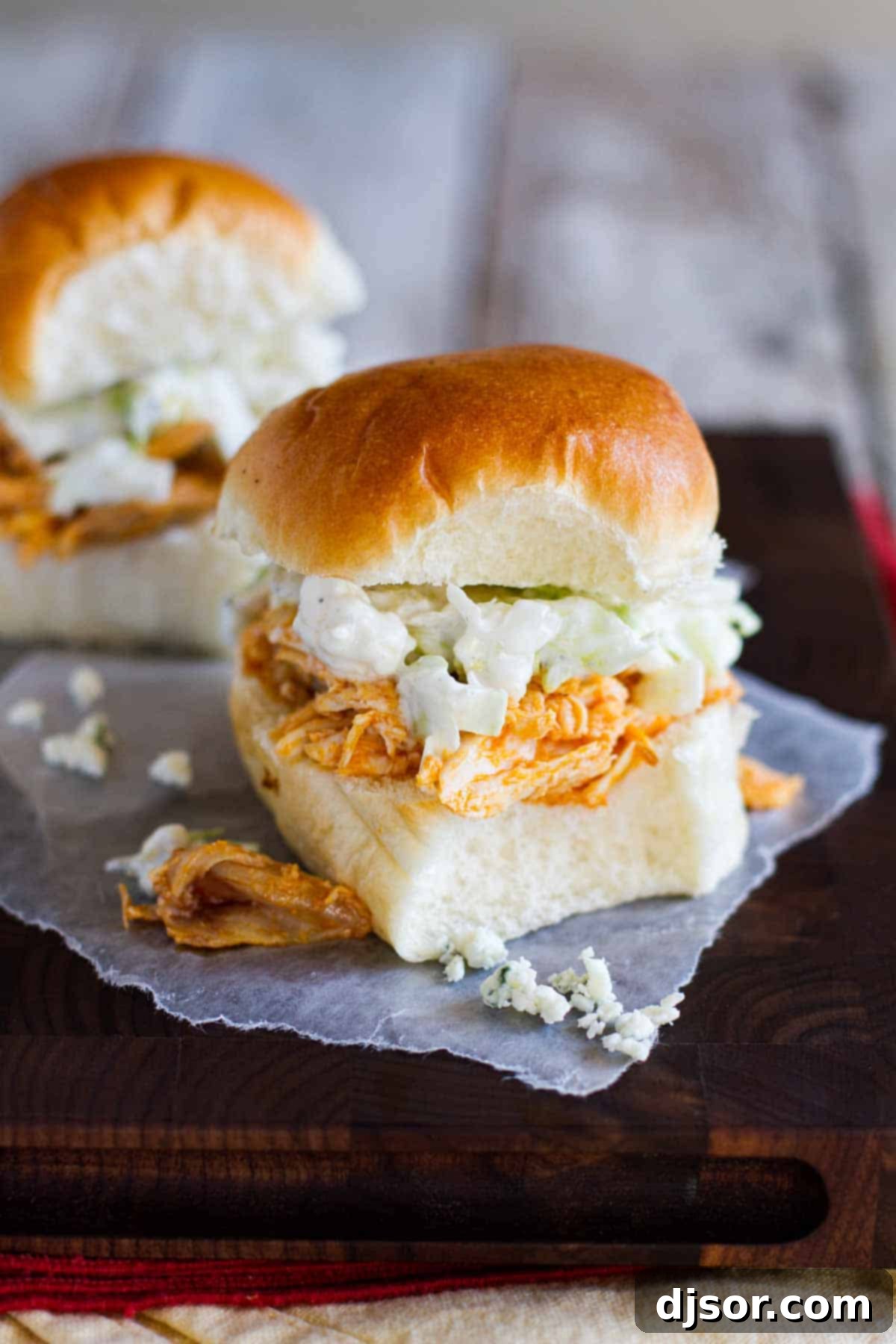 Delicious Buffalo Chicken Sandwiches arranged on slider buns, ready to be served at a game day party.