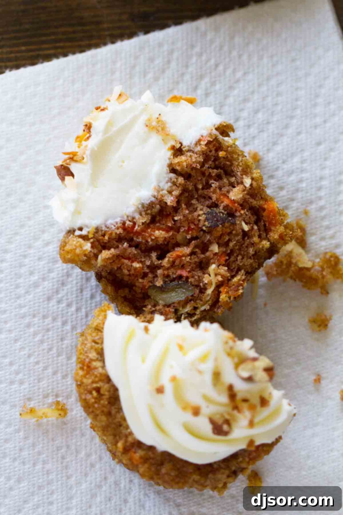 carrot cake cupcake cut in half to show interior
