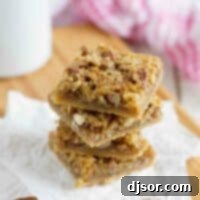 Stacked Coconut Pecan Bars showing their delicious layers.