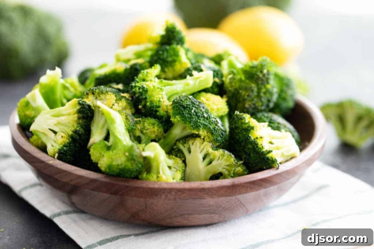 lemon broccoli in a wooden bowl, garnished with lemon zest